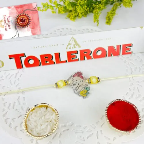 Joyful Kids Ganesh Rakhi with Toblerone Chocolate Combo
