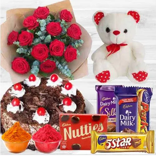 Awesome bouquet of  Roses with a delicious Cake, mixed Cadburys Chocolate and lovely Teddy Bear