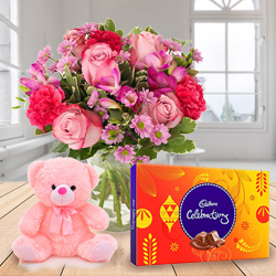 Brilliantly Arranged Mixed Flower in a Vase with Small Teddy and Cadbury Celebration Chocolates Brilliantly Arranged Mixed Flower in a Vase with Small Teddy and Cadbury Celebration Chocolates