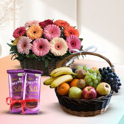 Shop for Mixed Fruits Basket with Gerberas Arrangement and Dairy Milk Silk