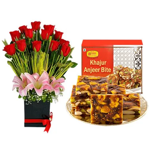 Khajur Anjeer Bite from Kandoi Bhogilal Mulchand with Designer Flower Arrangement