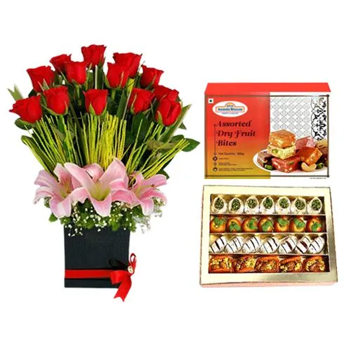 Assorted Dry Fruit Sweets from Adyar Ananda Bhawan with a Designer Flower Arrangement