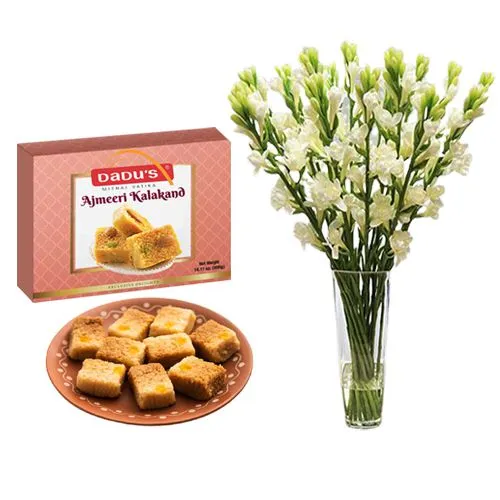 Ajmeeri Kalakand from Dadus with a Rajnigandha Stems in a Glass Vase