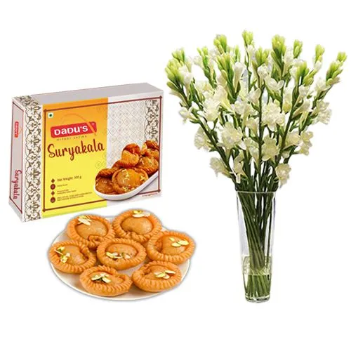 Suryakala from Dadus with a Rajnigandha Stems in a Glass Vase