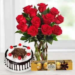 Send Bouquet of Red Roses with Ferrero Rocher and Black Forest Cake