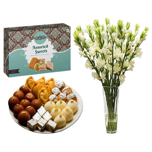 Assorted Sweets Box from Bombay Sweet Shop with Rajnigandha Stems in Glass Vase