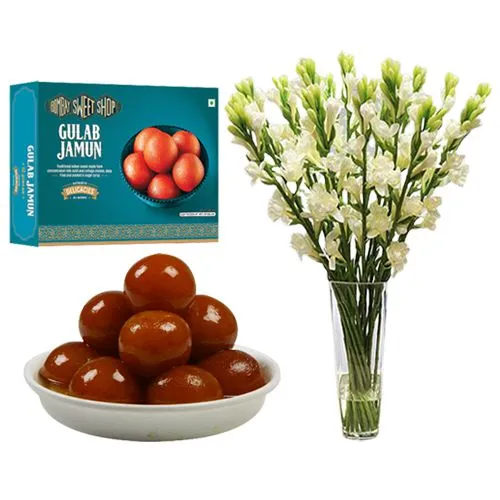 Gulab Jamun from Bombay Sweet Shop with a Rajnigandha Stems in a Glass Vase