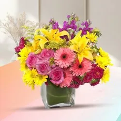 Exquisite Assorted Seasonal Flowers in a Glass Vase