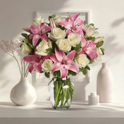 Delightful Glass Vase display of Pink Lilies with White Roses Delightful Glass Vase display of Pink Lilies with White Roses