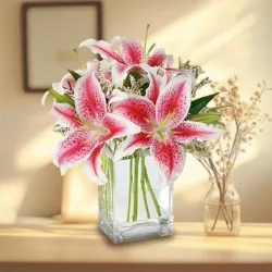 Attractive display of Pink Lilies in Glass Vase