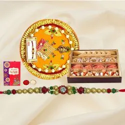 Assorted Sweets and Designer Pooja Thali along Rakhi, Roli, Tilak and Chawal