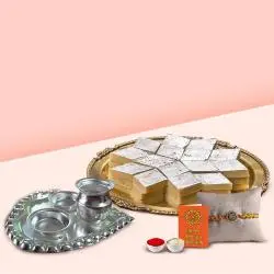 Kaju Katli from Haldiram and Silver Plated Paan Shaped Puja Aarti Thali along with Rakhi