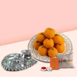 Laddoo from Haldiram and Silver Plated Paan Shaped Puja Aarti Thali along with Rakhi