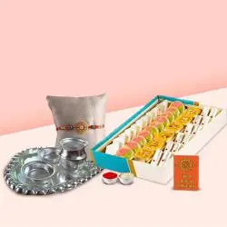 Assorted Sweets from Haldiram and Silver Plated Paan Shaped Puja Aarti Thali along with Rakhi