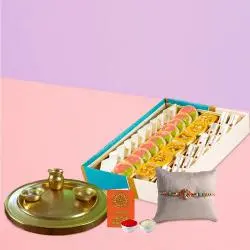 Assorted Sweets and Silver Plated Puja Thali along Rakhi, Roli, Tilak and Chawal