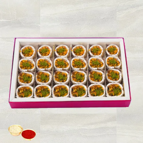 Kaju Pista Premium Sweets from Haldiram with free Roli Tilak and Chawal.