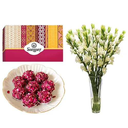 Kaju Rose Laddu from Sangam Sweets with Rajnigandha Stems in a Glass Vase