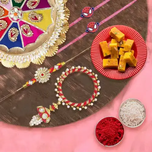 Charming Gift of Mysore Pak 1 Bhaiya Bhabhi Rakhi 2 Kids Rakhi and 1 Rakhi Thali
