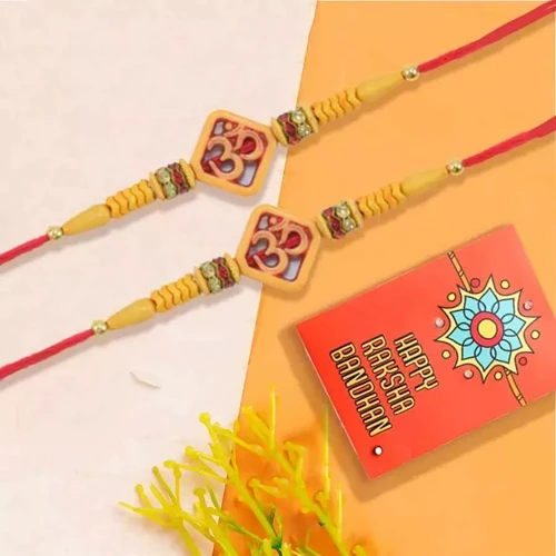 Charming Om Rakhi Pair with Roli Chawal Tika n Rakhi Card