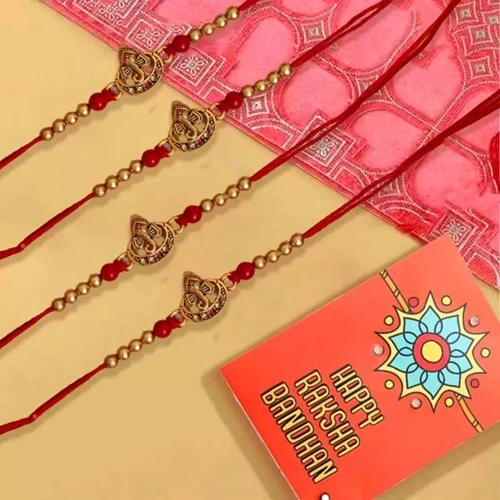 Astonishing Four Ganesh Rakhi Set with Roli Chawal Teeka n Card