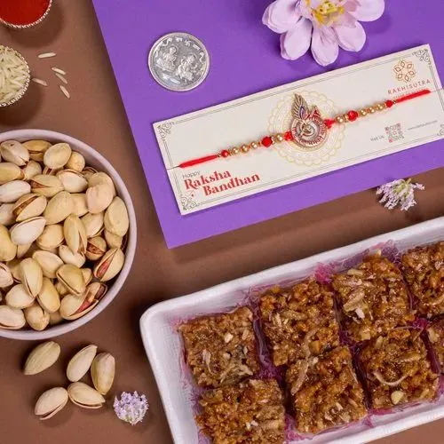 Magnificent Rakhi with Dodha Barfi  N  Pistachio Gift